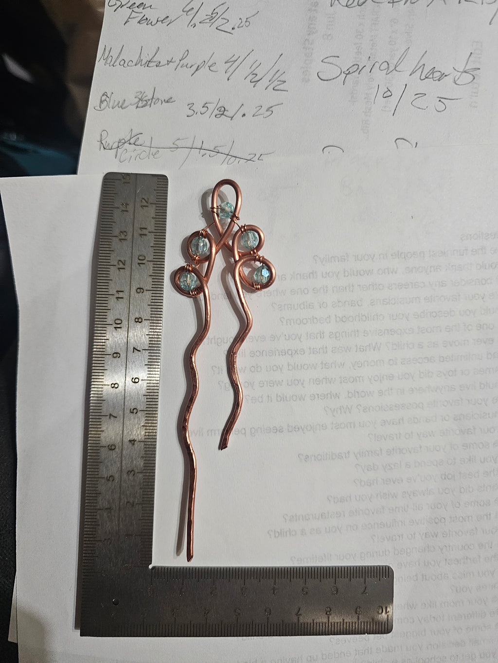 Single copper hairpin with light blue accents