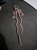 Single copper hairpin with light blue accents