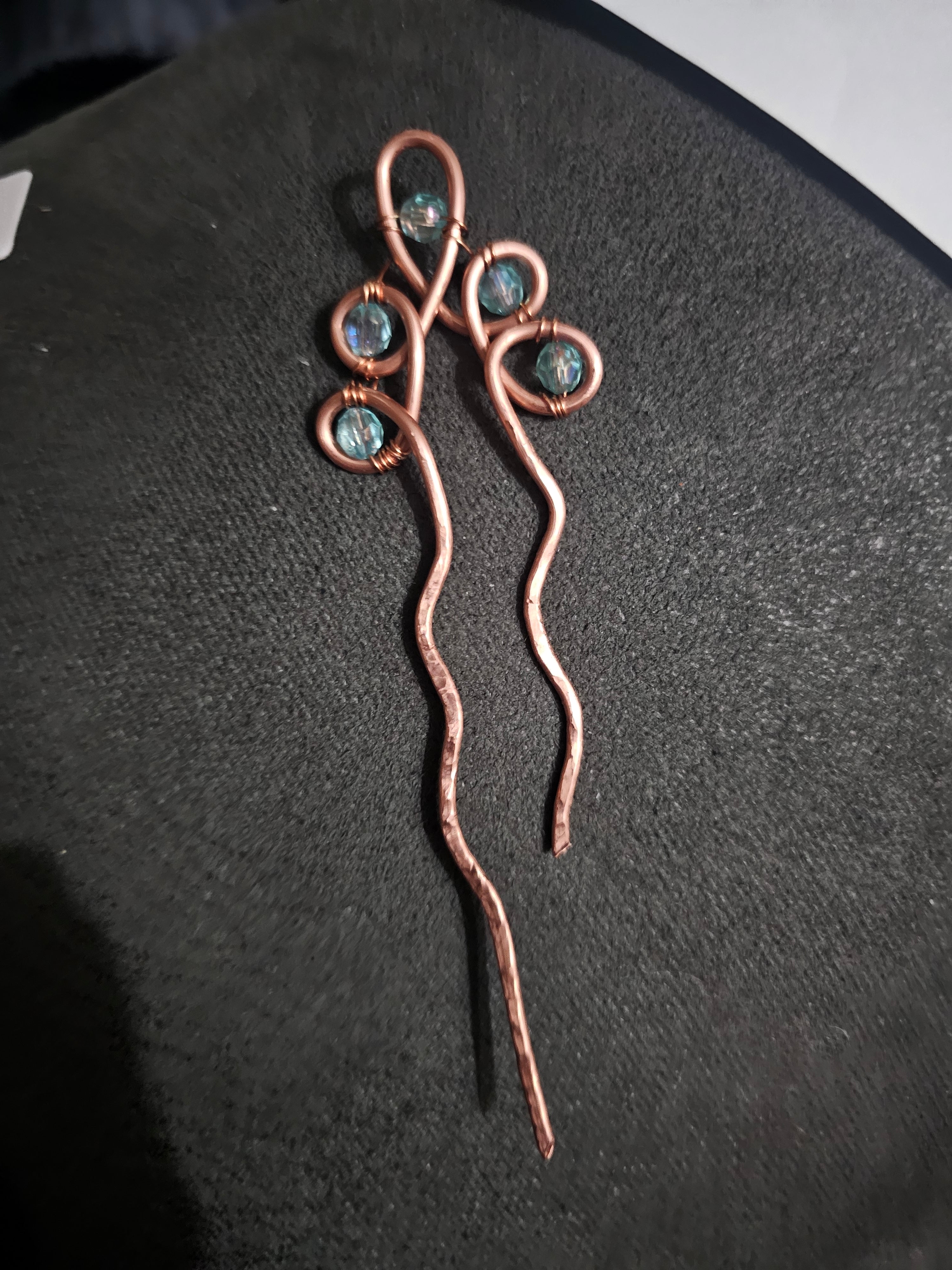 Single copper hairpin with light blue accents