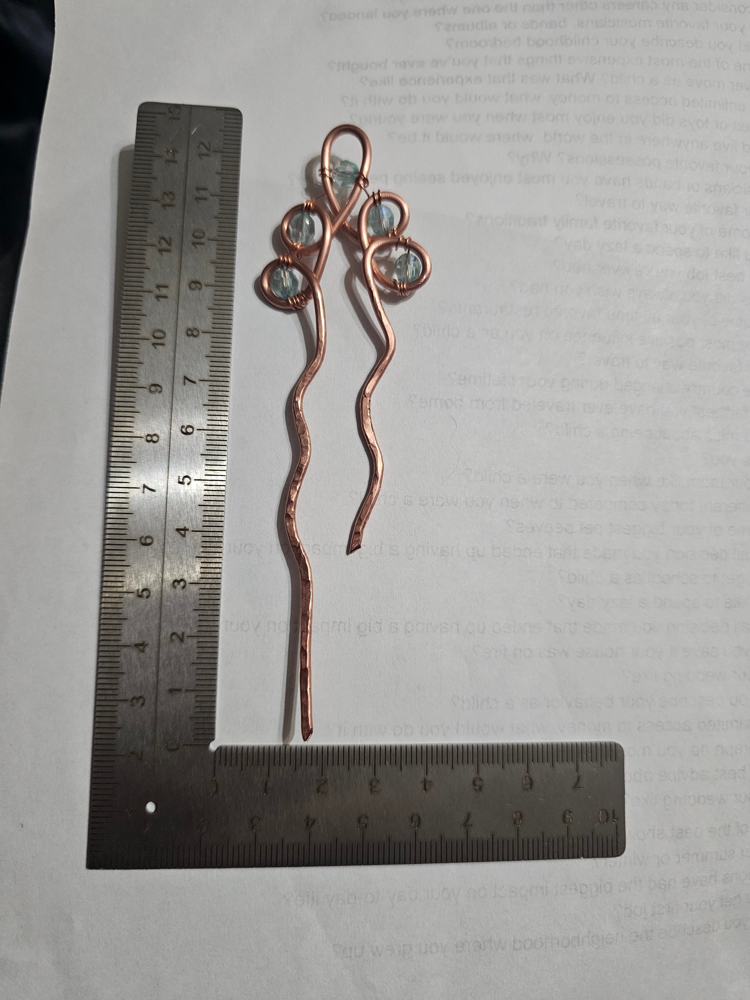 Single copper hairpin with light blue accents